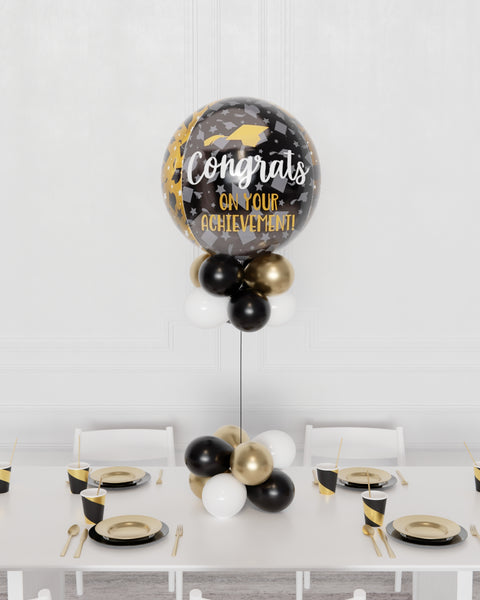 Congrats Grad Balloon Centerpiece - Black, Gold, and White, sold by Balloon Expert