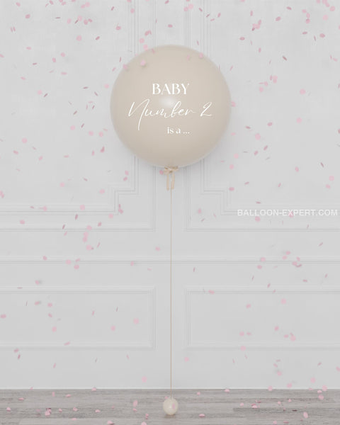 Gender Reveal Balloon Filled with Confettis in Cream, it's a girl