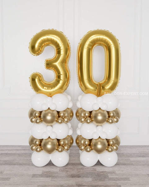 Gold and White Double Number Balloon Columns, inflated with air