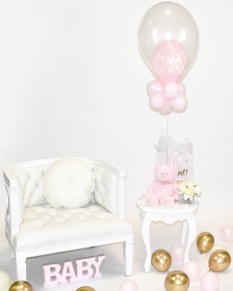 Centre de table ballon rose pour fête prénatale