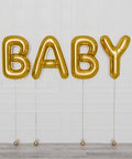 Baby Supershape Balloons in gold helium inflated