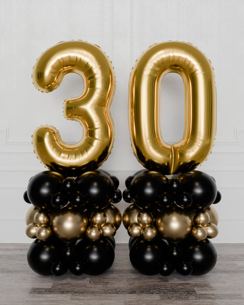 Black and Gold Double Number Balloon Columns, inflated with air