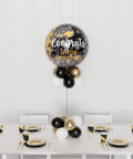 Congrats Grad Balloon Centerpiece - Black, Gold, and White, sold by Balloon Expert