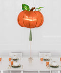 Fall Pumpkin Supershape Balloon with Tassel, inflated with helium