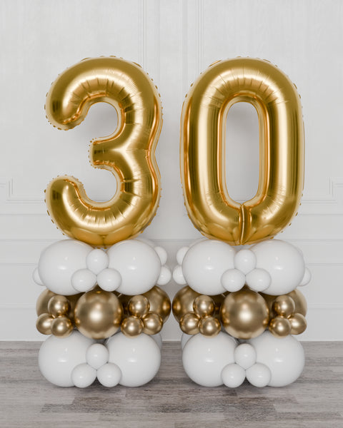 Gold and White Double Number Balloon Columns, inflated with air