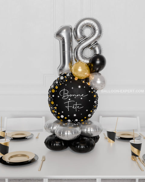 Happy Birthday Quad Number Balloon Centerpiece in Black, Gold, and Silver, inflated with air