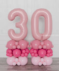 Pink and Fuchsia Double Number Balloon Columns, inflated with air