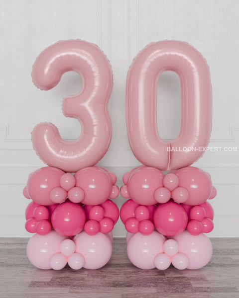 Pink and Fuchsia Double Number Balloon Columns, inflated with air