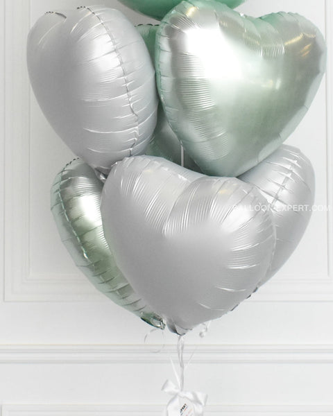 Mint green and white heart foil balloons, closer image