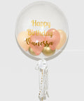 Rose Gold, Peach, and Gold -  Personalized Bubble Balloon, helium inflated from balloon expert, closer image